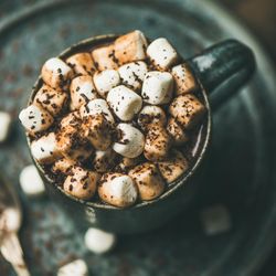 Close up of marshmallows topping of hot drink in mug, square crop