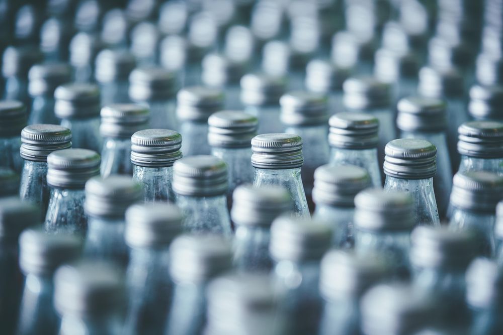 Rows of tops of bottles