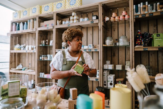 Mature Black woman in soap shop