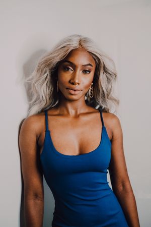 Charming Black woman in blue trendy dress