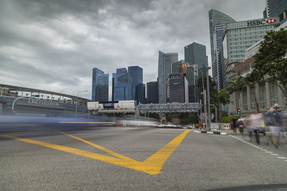Singapore - October 22, 2019: Downtown traffic in the central area, Fullerton Rd and Esplanade Dr