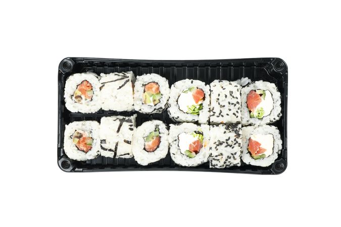 Box with sushi isolated on plain background