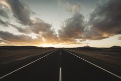 Center of the road at sunset