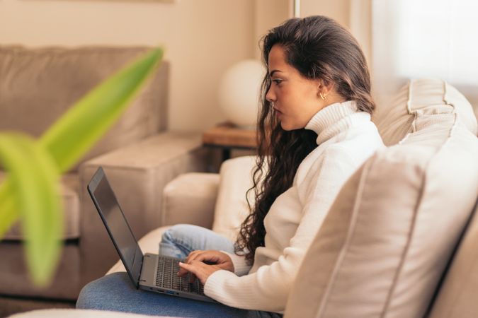 Home Productivity: Young Woman Working on Laptop