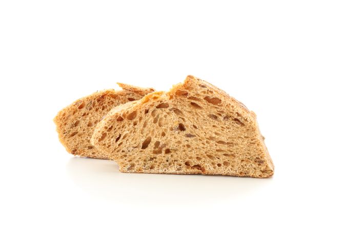 Wheat bread pieces isolated on blank background. Bakery products