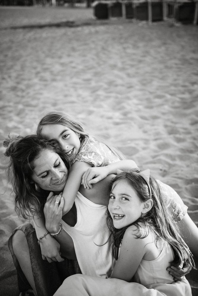 Playing woman with kids on beach