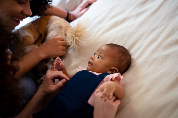 Woman looking down at infant