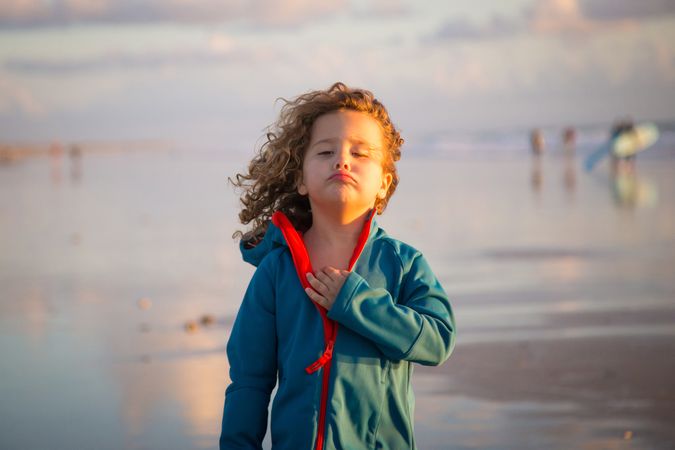 Little girl walking on seashore