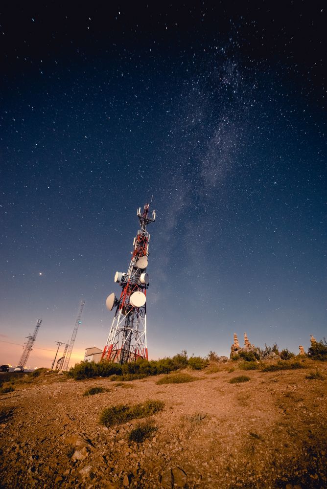 Radio tower against starry sky