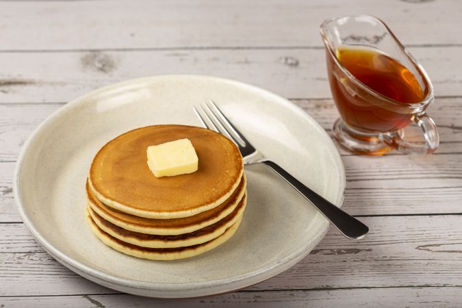 Delicious pancakes with butter and honey.