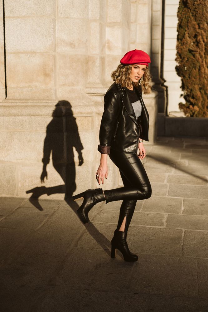 Stylish female in beret looking at camera