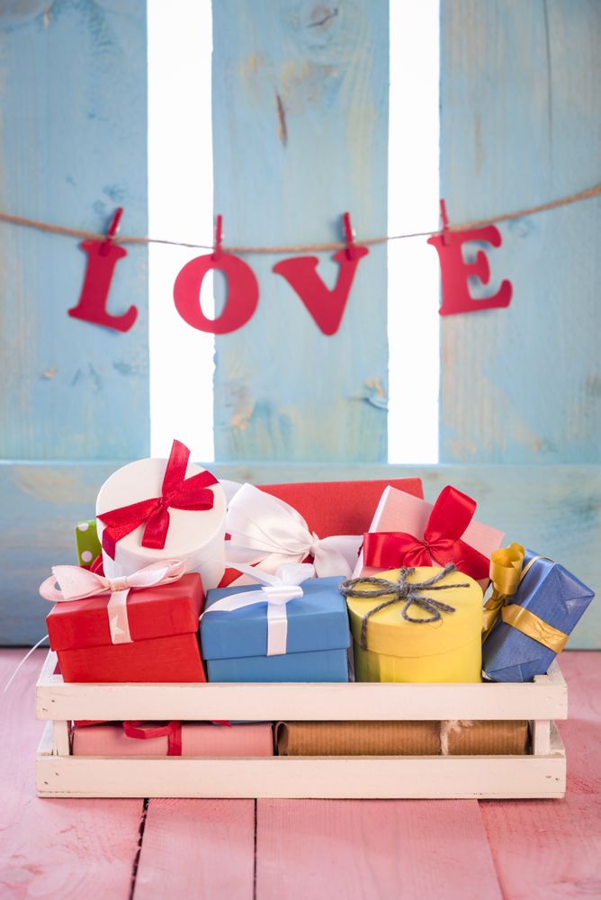 Gifts in a crate and the word love as a banner