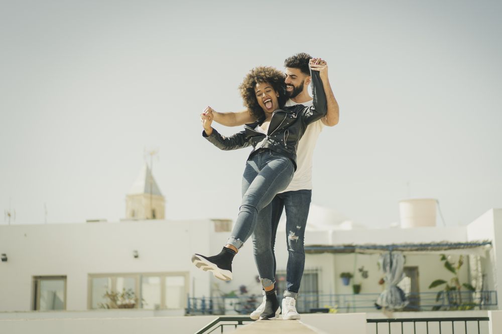 Young couple having fun on street