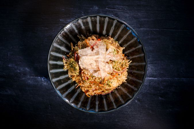Delicious dish of rice in bowl served on table