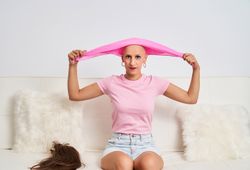 a woman suffering from cancer wearing a hairless headscarf for chemotherapy medical treatment