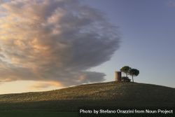 Tuscany, Maremma landscape, old windmill and trees on top of the hill 5XrKP7