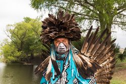 Calvin Osife in traditional dress at the Celebrations of Traditions Pow Wow, San Antonio, Texas v4m8d5