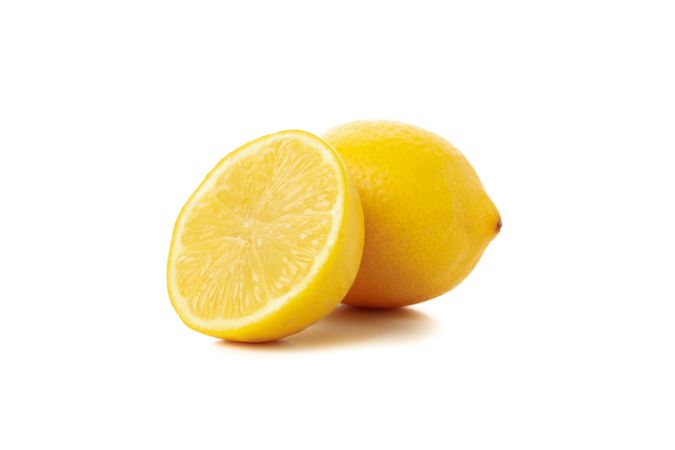 Fresh lemon isolated on light background. Ripe fruit
