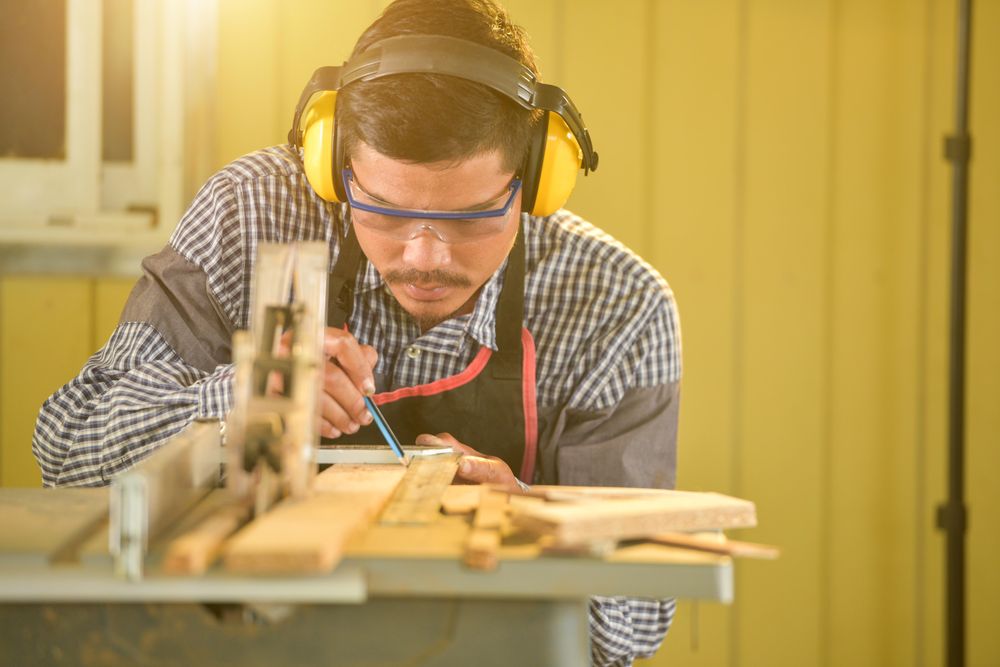 Carpenter taking measurements