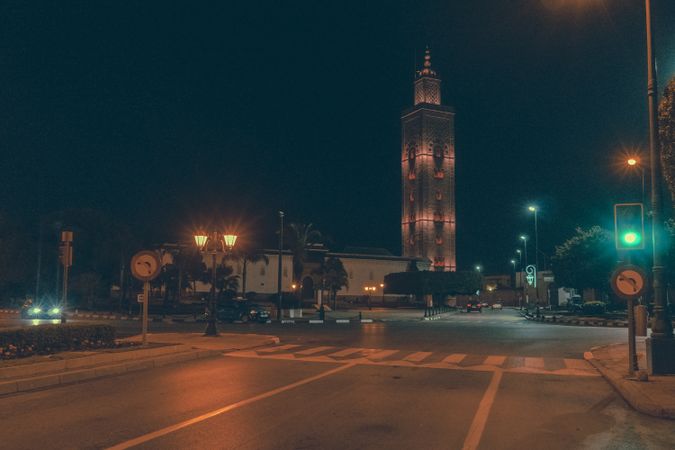 Road on street near high tower at night