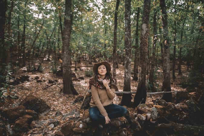 Young woman relaxing in forest