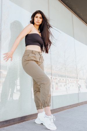 female standing near wall