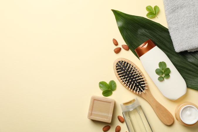 Composition of personal hygiene with bottles of cosmetics on beige background