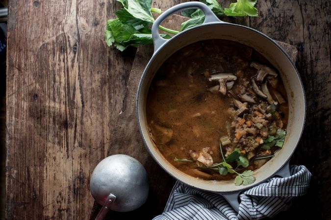 Bread and parsley near quinoa soup
