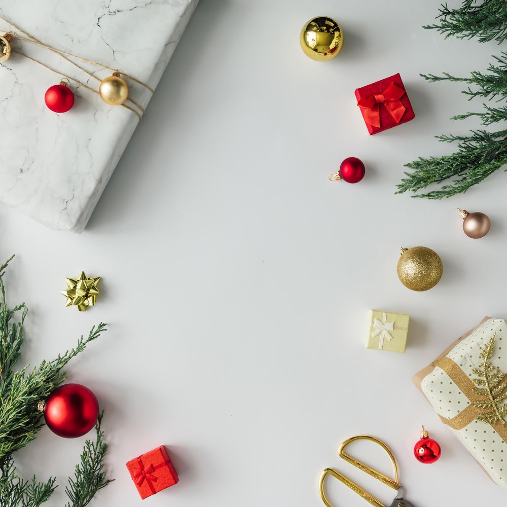 Christmas layout made of presents, branches, baubles on light background