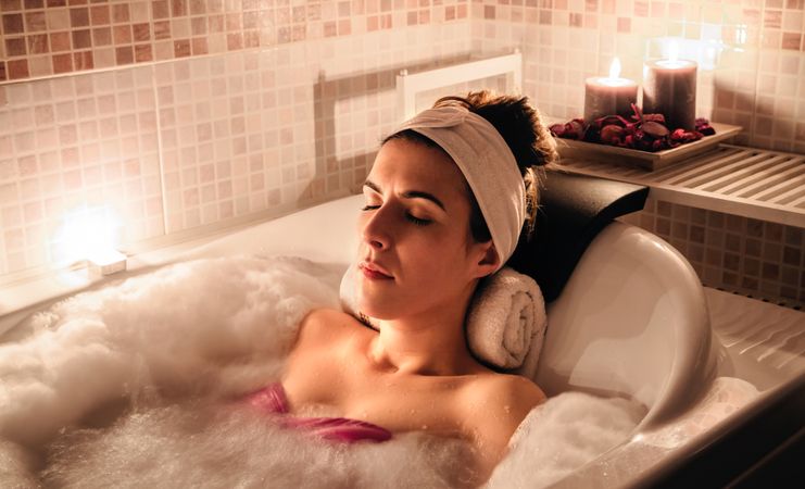 Woman relaxing in therapeutic bath