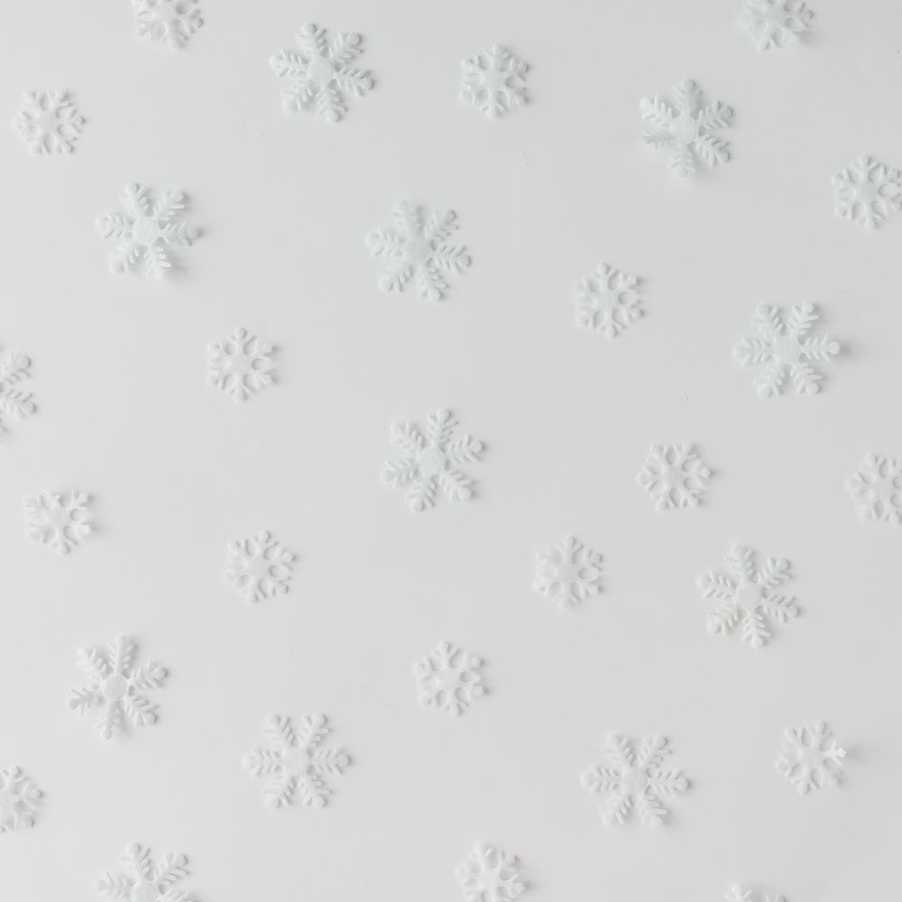 Winter snowflake pattern on light background