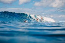 People surfing on sea waves