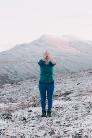 Woman posing on hill in snow