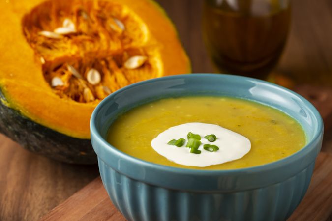 Bowl with pumpkin soup on the table.