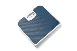 Blue weigh scales isolated on plain background