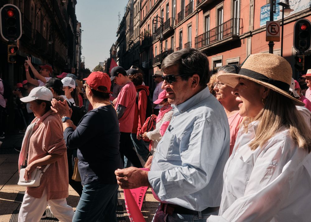 Mexico City, Mexico - February 26th, 2022: Side view of large group of people walking at protest