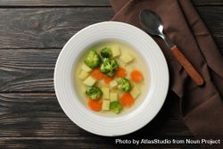 Potato, carrot and broccoli soup on table bxJ1v5