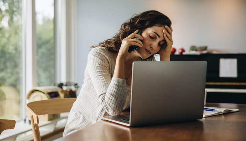 Woman feeling tired while working from home