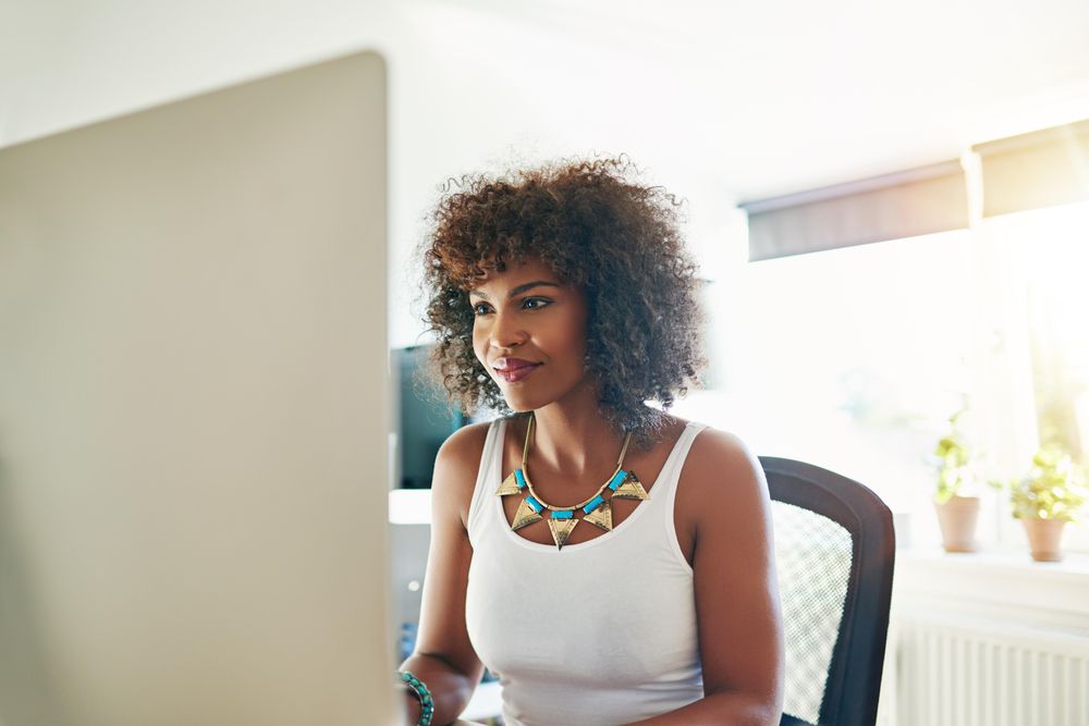 Businesswoman in bright office doing her work in the morning