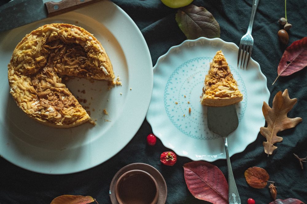 Apple pie with a crispy layer with one piece taken out