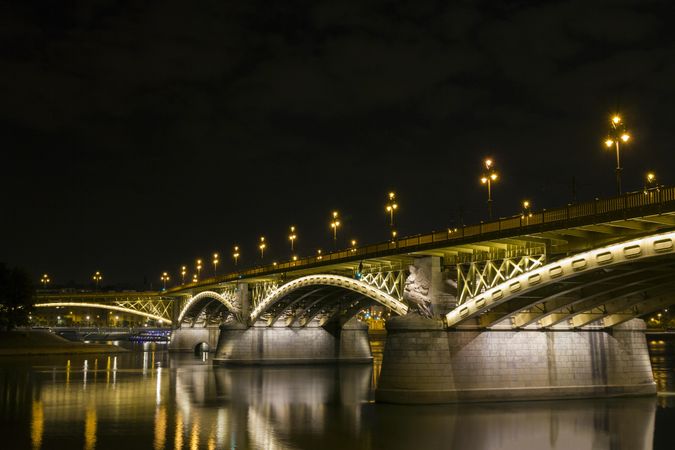 Lit up bridge in Budapest, Hungary on dark night