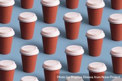 Disposable coffee cups on blue background 48ZWZ0