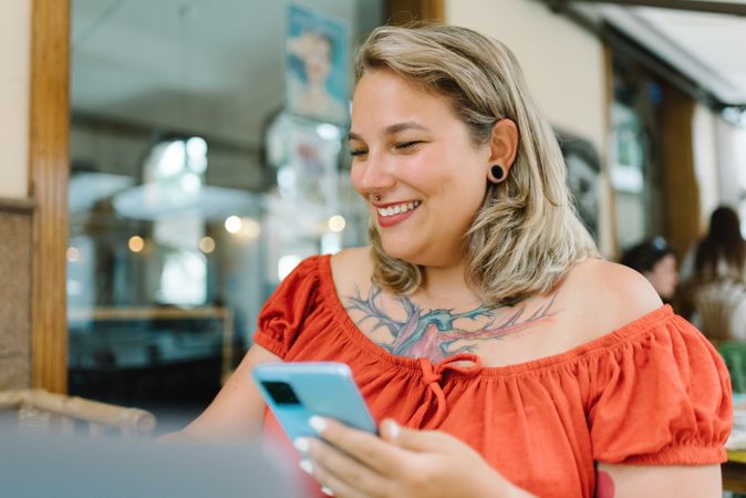 Focus woman working on laptop in cafe