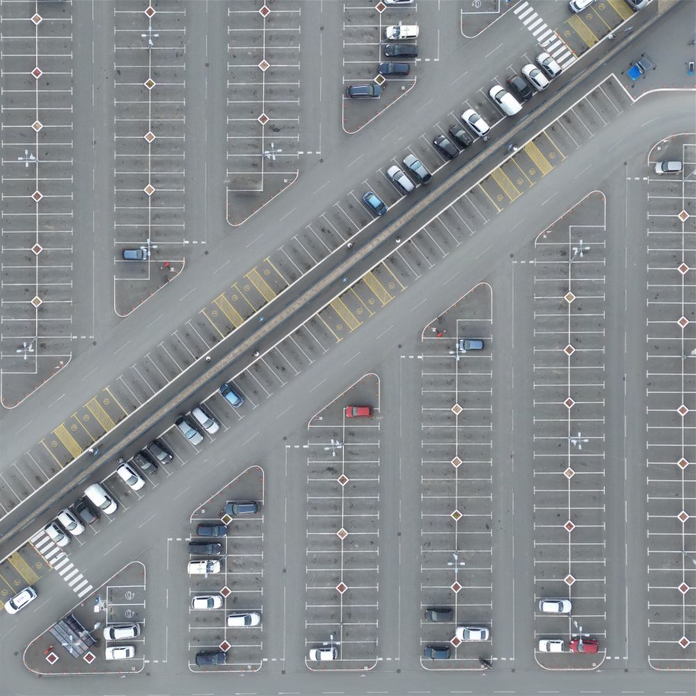 Aerial view of a half empty parking lot