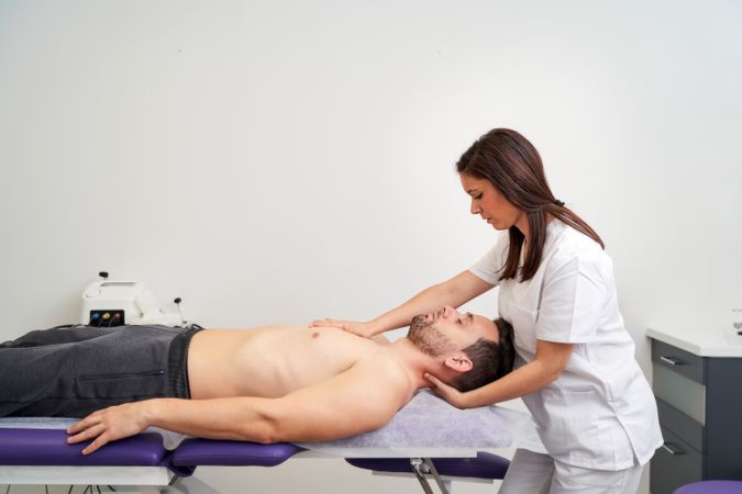 a man being treated for a spinal cord injury at the physiotherap