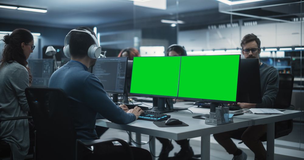 Group of Diverse Multicultural Men and Women Working on Desktop Computers in a Research Center.