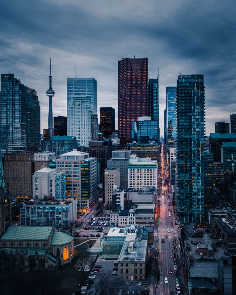 City skyline under gray cloudy sky