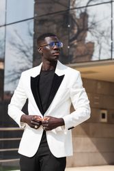 Stylish businessman in eyeglasses in town
