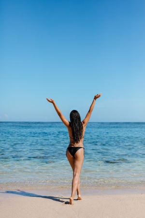 Woman in bikini enjoying serene nature