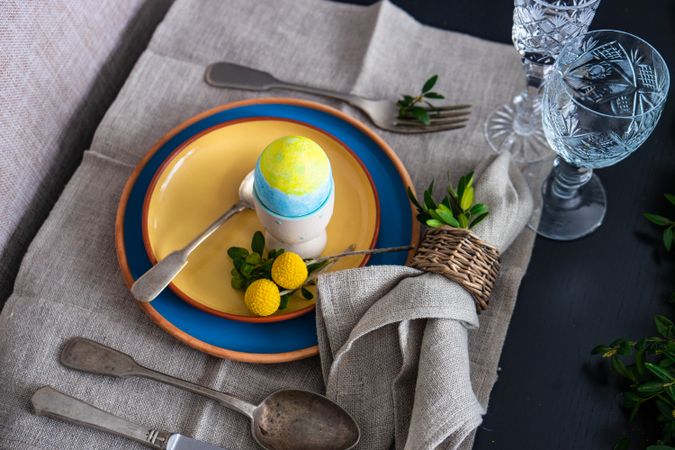 Easter table setting with painted egg